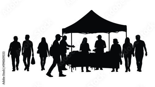 A group of people gathered around a table under a tent