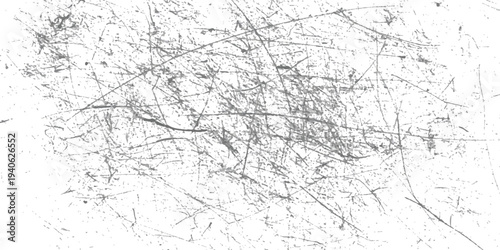 A grunge texture background with distressed scratches and specks on a white surface