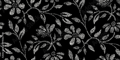 Intricate floral pattern with dotted white blossoms on a black background