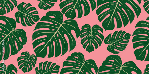 Seamless pattern of vibrant monstera leaves against a soft pink backdrop