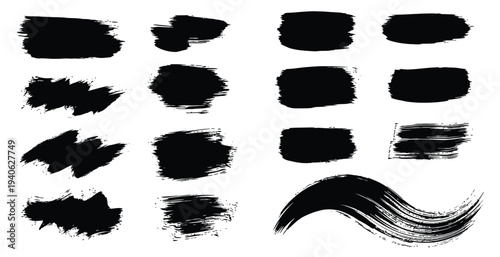 Collection of black brush strokes and smudges on white background for artistic and design purposes