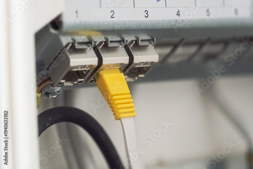Obraz na plátne Electrical Panel Cable Connection In Cabinet With Yellow Connector Close Up