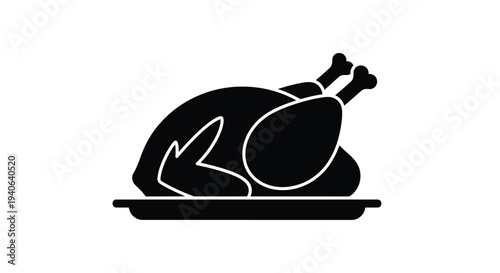 A black silhouette of a roasted chicken served on a platter