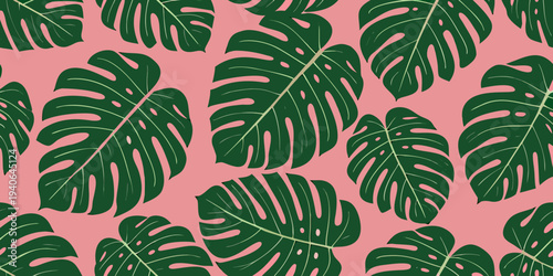 Seamless pattern of vibrant green monstera leaves on a soft pink background