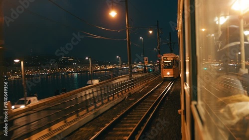 Tram Moving Near The Danube River in The Night Of Budapest 