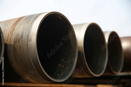 Corroded industrial drill pipes at wellsite