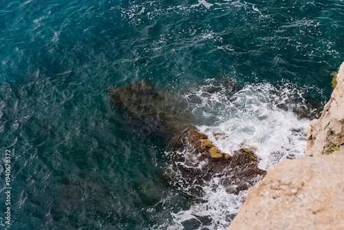 waves crashing on rocks