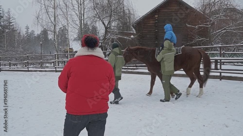 Hippotherapy for a child with cerebral palsy syndrome on a cold winter day