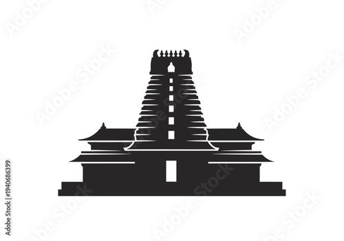 Black silhouette of a tiered Dravidianstyle temple tower gopuram and surrounding structures