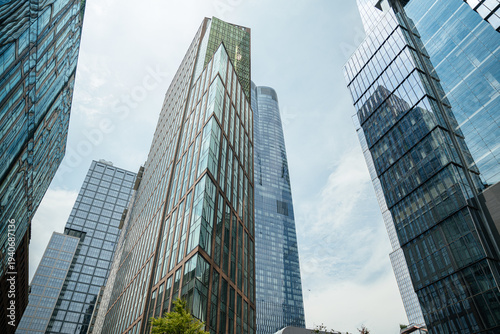 Tableau sur toile Tall modern glass towers rising into the sky in Manhattan, New York City