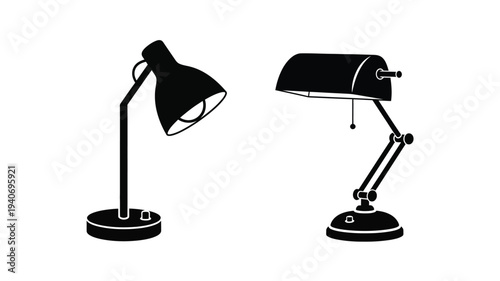 Two vintage desk lamps presented in a stark black silhouette