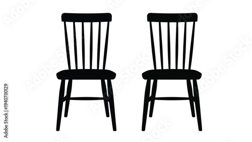 Two vintage wooden chairs displayed against a plain white background silhouette