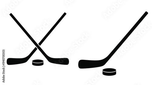Two crossed hockey sticks and pucks create a striking silhouette