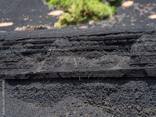 Volcanic ash layers showing geological stratification and erosion