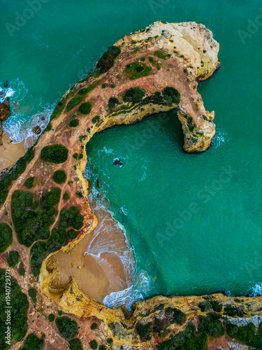 Turquoise Ocean Lagoon and Coastal Cliffs Aerial View