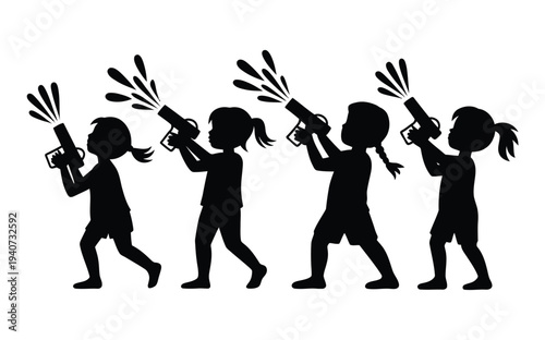 Four young girls holding water guns march forward firing streams of.