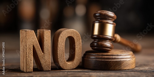 Gavel and the word NO on a wooden surface representing legal rejection