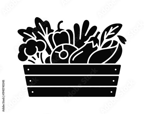 Crate displays assorted fresh garden vegetables.