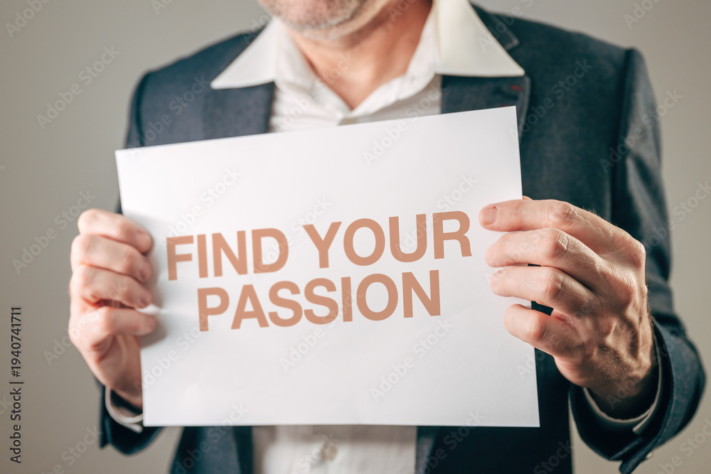 Fototapeta premium Businessman motivational speaker holding sign with FIND YOUR PASSION motivational text