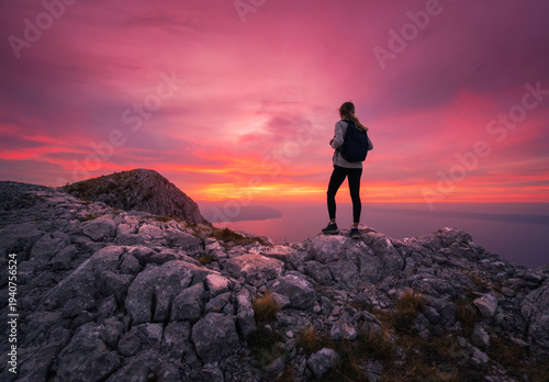 Silhouette of woman with ba...