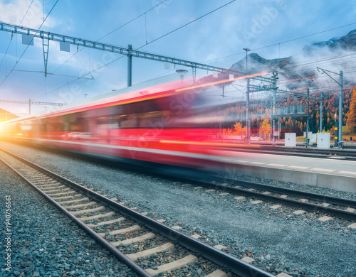 Blurred red passenger train...