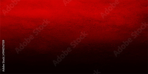 Old vintage red grunge texture pattern on a dark blood colored wall backdrop creates a grungy wallpaper design for a weathered material surface