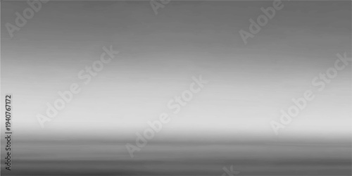 A sleek silver brushed metal texture background features a shiny stainless steel pattern and gray metallic gradient design on a textured aluminum surface backdrop