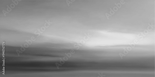 Dramatic storm clouds and dark mist swirl over mountain peaks under a moody sky, creating an abstract texture of light and smoke in this stormy nature cloudscape