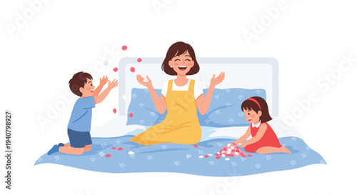 A joyful mother sits on a blue patterned bedspread with her two young children, who are playfully scattering and collecting colorful petals around her.