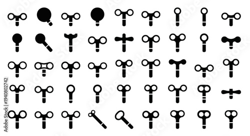 Collection of various antique keys and keyhole symbols in a grid pattern on a plain background viewed from directly above