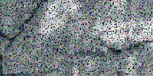 Textured abstract background with a dense pattern of multicolored dots and soft light effects creating a subtle visual depth