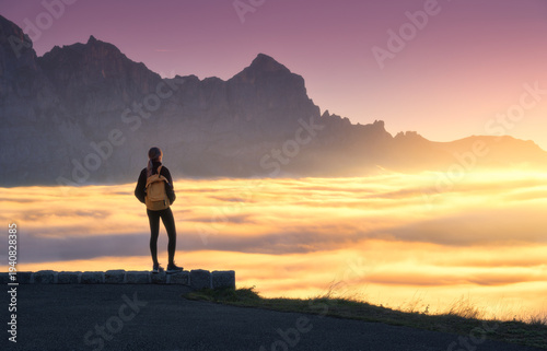 Woman with yellow backpack ...