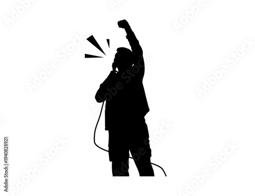Silhouette of Male Singer Performing with Microphone
