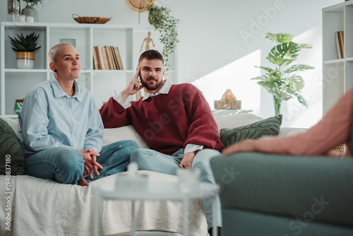 Wallpaper Mural Young couple receiving relationship counseling at therapy session Torontodigital.ca