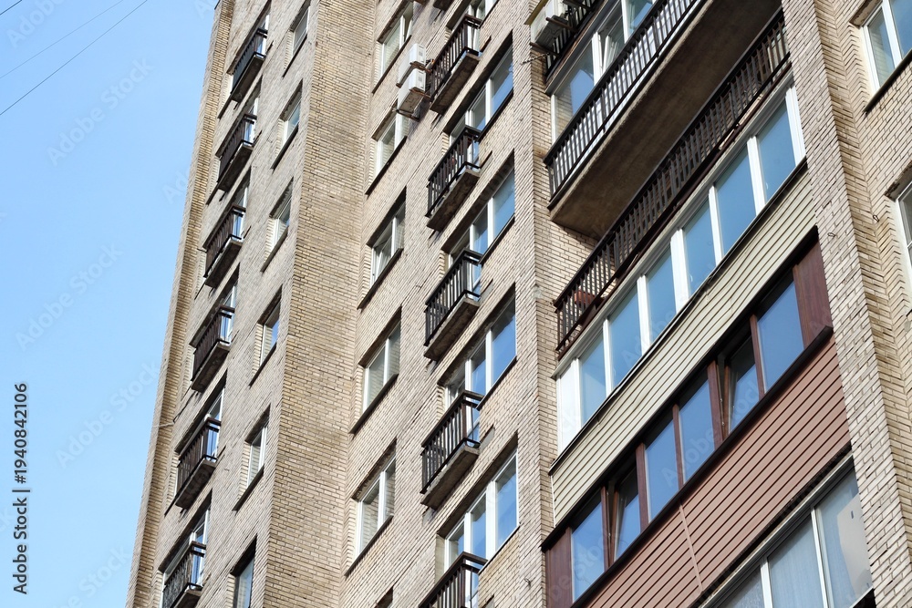 Fototapeta premium An old block of flats with balcony soviet building architecture urban background photo 