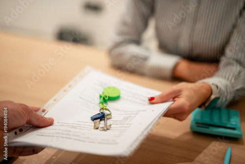 Photos Client completing property agreement, receiving new keys