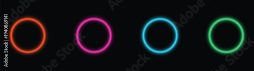 Four luminous glowing rings display shades of orange, pink, blue, and green on a pure black field