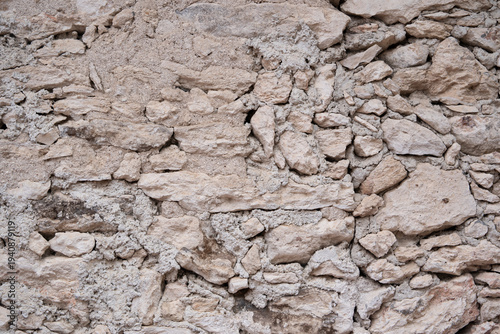 textura de pared rústica de piedra color arena