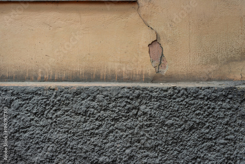 Cracked Wall with Textured Plaster and Concrete Surface Detail