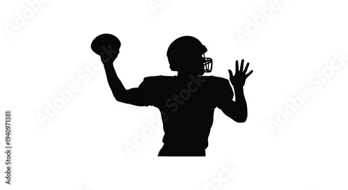 Silhouette of a football player preparing to throw the ball