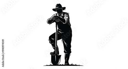 A man in a hat stands with a shovel in a farming pose
