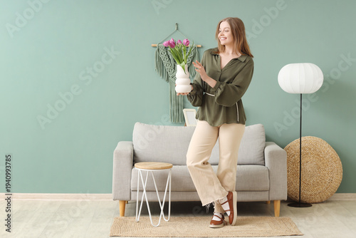 Young woman with tulips in ...