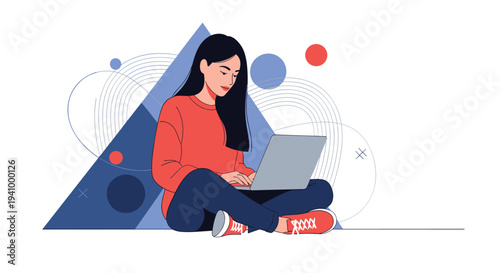 Focused young woman sitting on the floor with her legs crossed while working on a laptop against a geometric background.