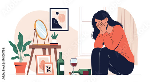Depressed and sad young woman sitting on the floor with her head in her hands next to empty wine bottles in a lonely room.