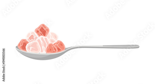 A horizontal silver metal spoon filled with a pile of irregular pinkish-red marbled meat cubes or salt crystals isolated on a plain white background.