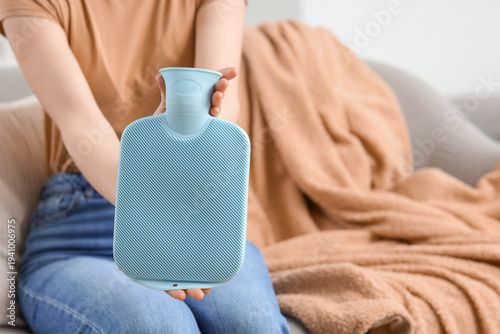 Young woman with blue hot w...