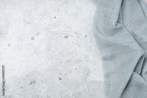 Empty stone tabletop with rustic blue cloth for product mockup. Top view. Great for social media posts. Flat lay. Perfect for lifestyle and food backgrounds.