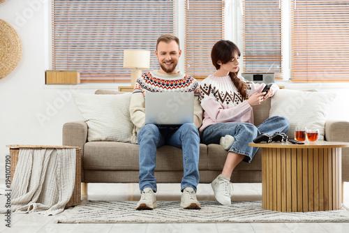 Young happy couple in warm ...