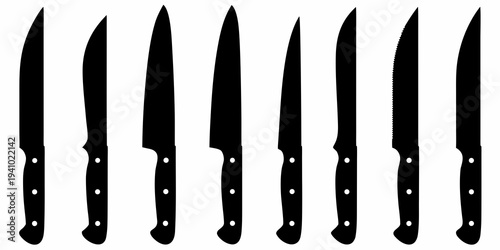 A collection of various black silhouette kitchen knives displayed in a row