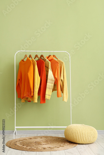 Cozy autumn sweaters hangin...